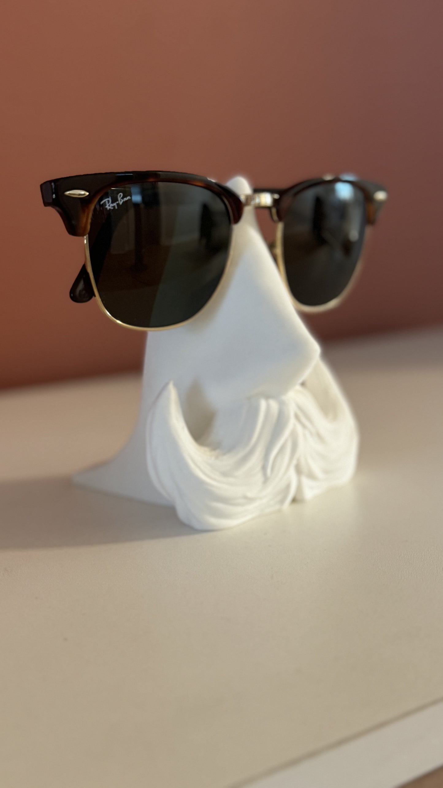 Close-up of the Distinguished Gentleman Glasses Stand, featuring intricate detailing and a smooth finish.