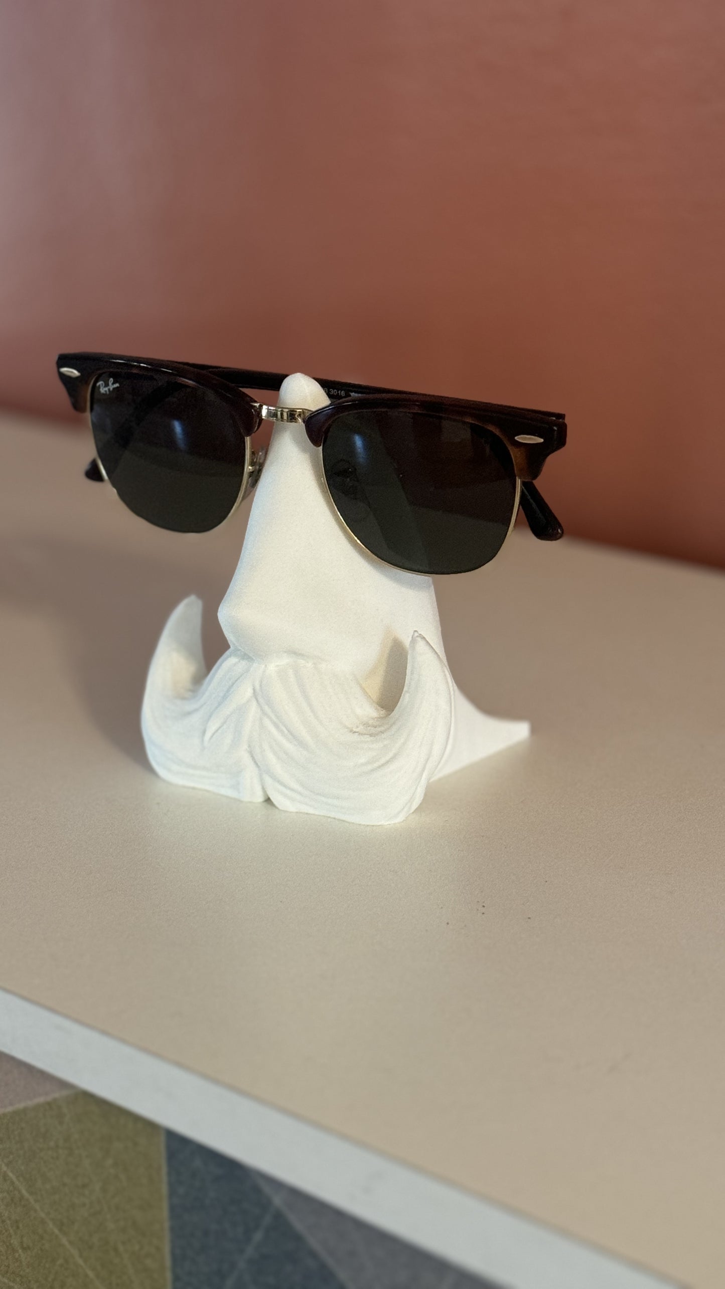 Detailed close-up of the Distinguished Gentleman Glasses Stand, highlighting the fine craftsmanship and elegant material finish.