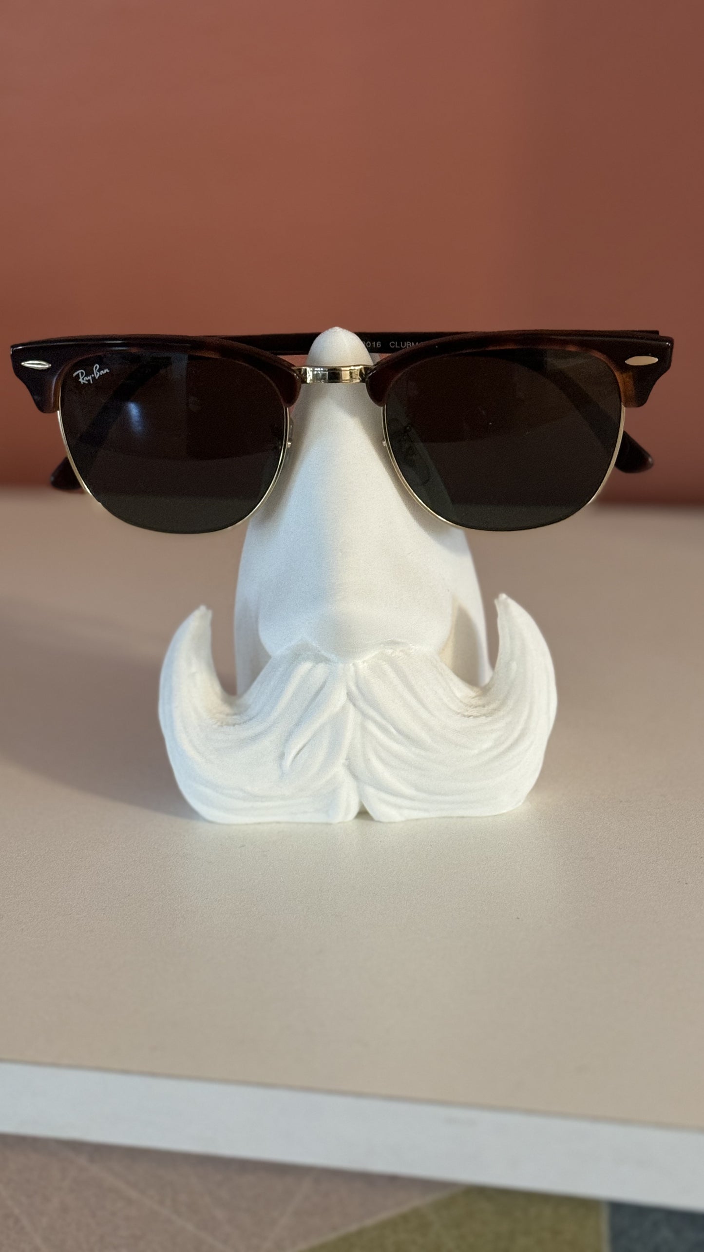 Front view of the Distinguished Gentleman Glasses Stand, showcasing a refined design perfect for holding glasses in style.