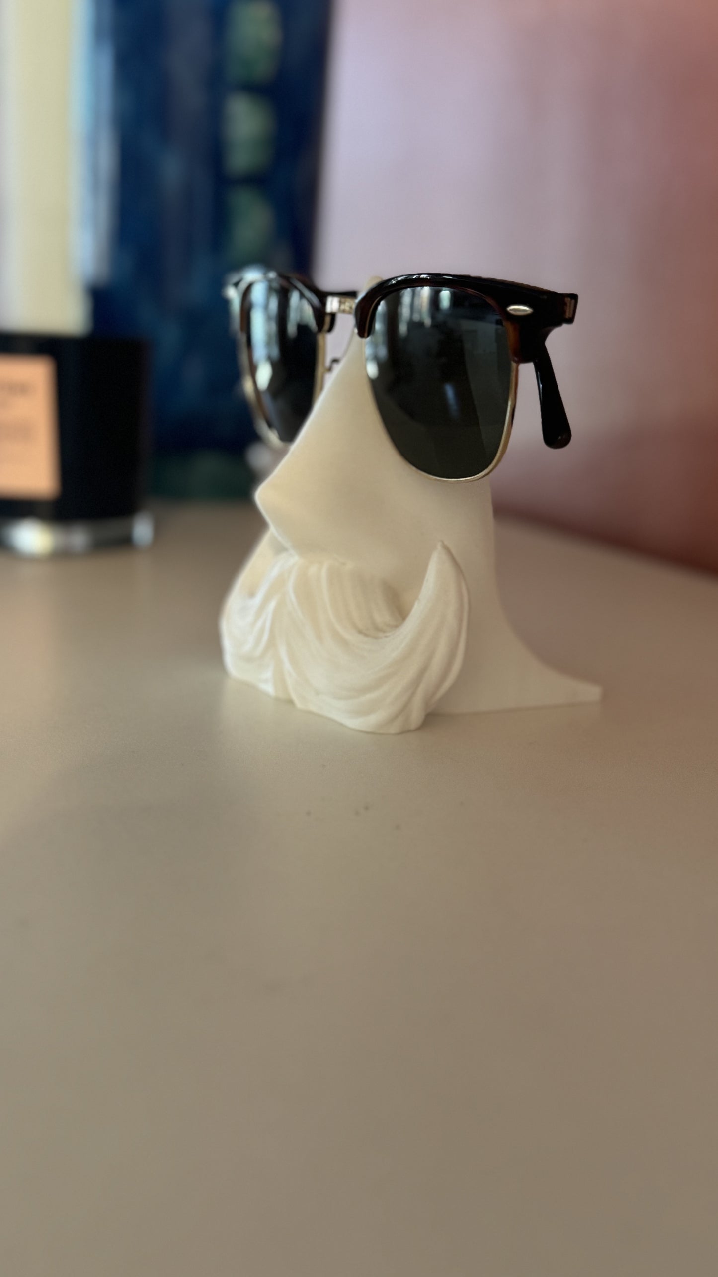 Distinguished Gentleman Glasses Stand displayed with accessories, demonstrating how it complements other items on a desk or dresser.