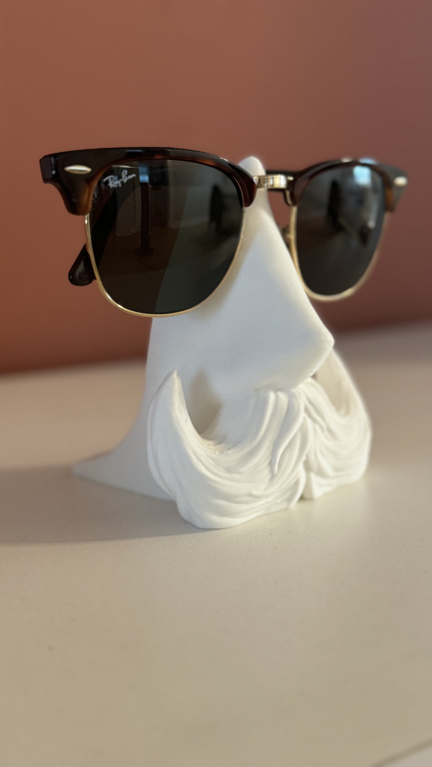 Side profile of the Distinguished Gentleman Glasses Stand, highlighting the sleek contours and elegant craftsmanship.