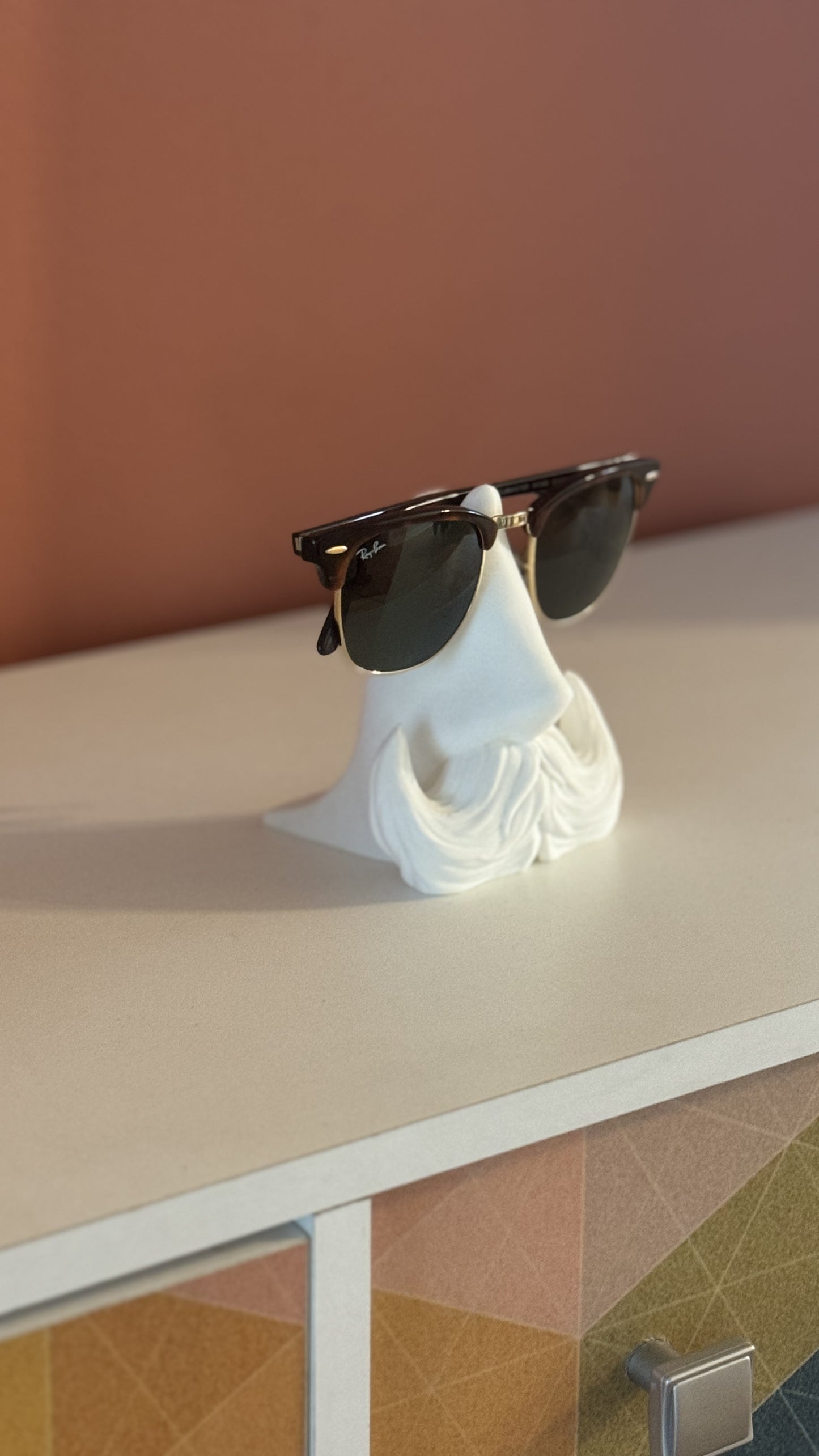 Top view of the Distinguished Gentleman Glasses Stand, showcasing its smooth surface and compact design for holding glasses.