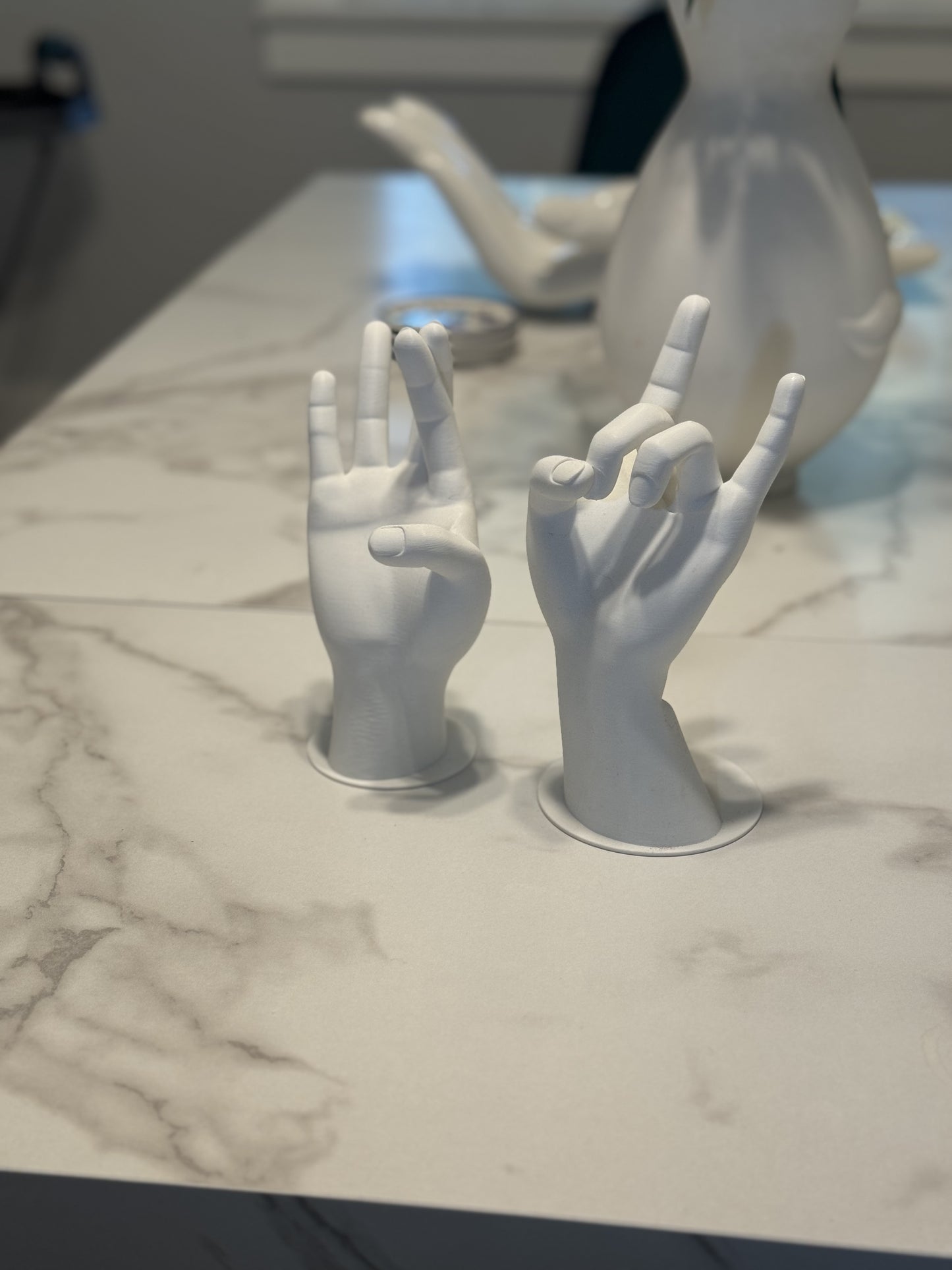 Elegant and modern jewelry hand stand, showcasing rings, bracelets, and necklaces with a sleek, minimalist design.