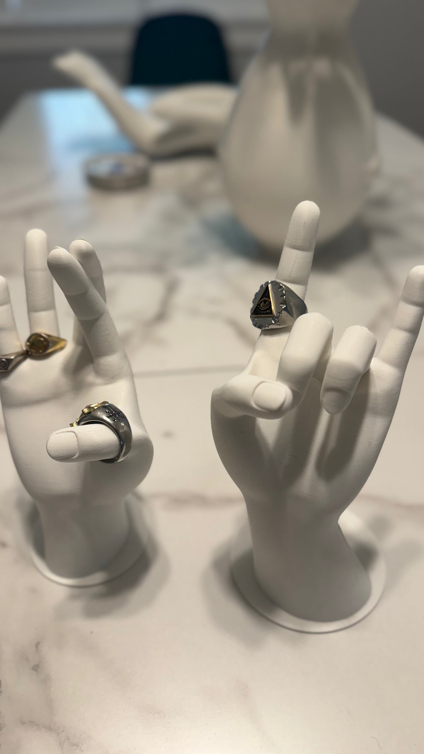 Stylish Jewelry Hand Stand in white, showcasing its ability to hold necklaces, rings, and other accessories in a sleek design.